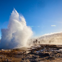 Vacationer in the spray of Iceland's Geysir