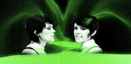 still from Tiësto's "Feel it in My Bones" music video featuring Tegan and Sara